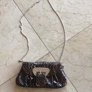 Brown clutch bag with strap